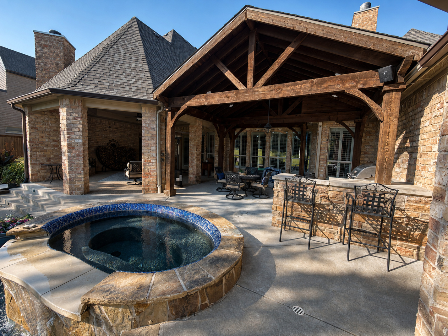 Completed Bound AV audio installation around a Trophy Club pool, hot tub and covered patio